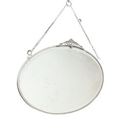 Wall mirror of oval form with stylised mount and bevelled plate, W56cm