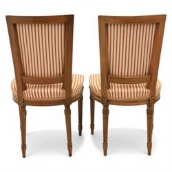 20th century Louis XVI style beech salon suite, comprising settee and four chairs, the settee with shaped rectangular back and upholstered arms over a shaped seat, the chairs with rectangular backs and overstuffed seats, each upholstered in striped fabric with close-nailed borders, upon fluted tapering supports headed by carved paterae, terminating in toupie feet, chairs H89cm W47cm