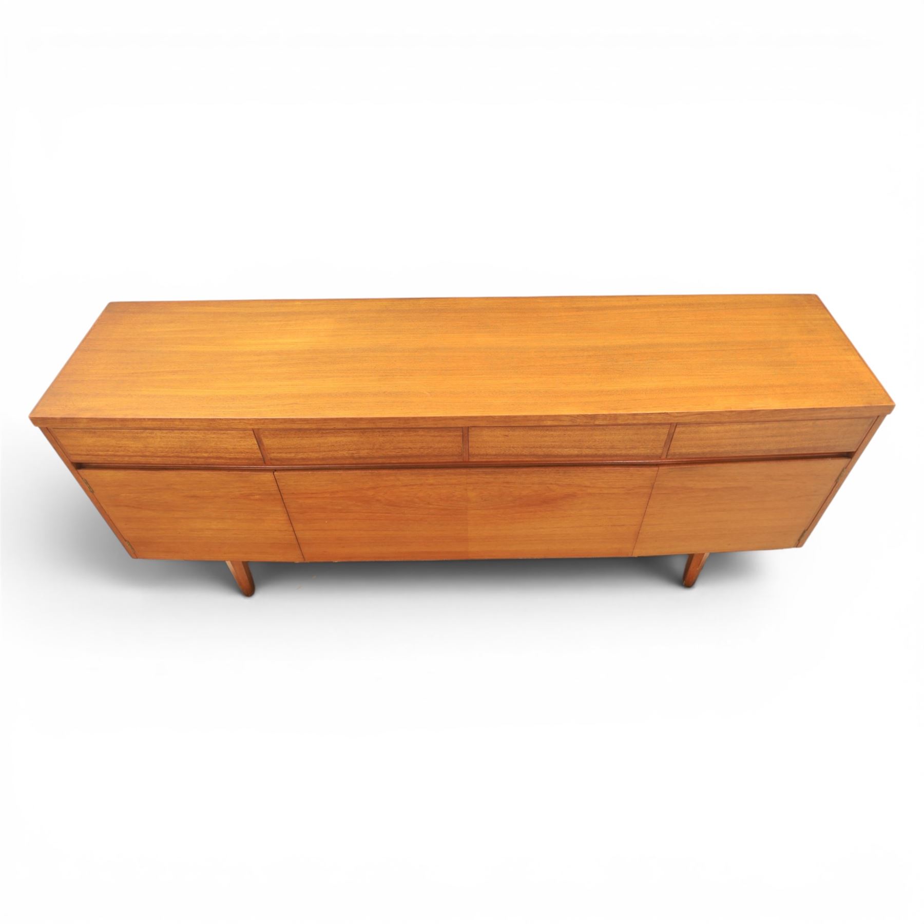 Mid-20th century teak sideboard, rectangular top above four frieze drawers with recessed handles, flanked by two cupboard doors with fall front central media cupboard