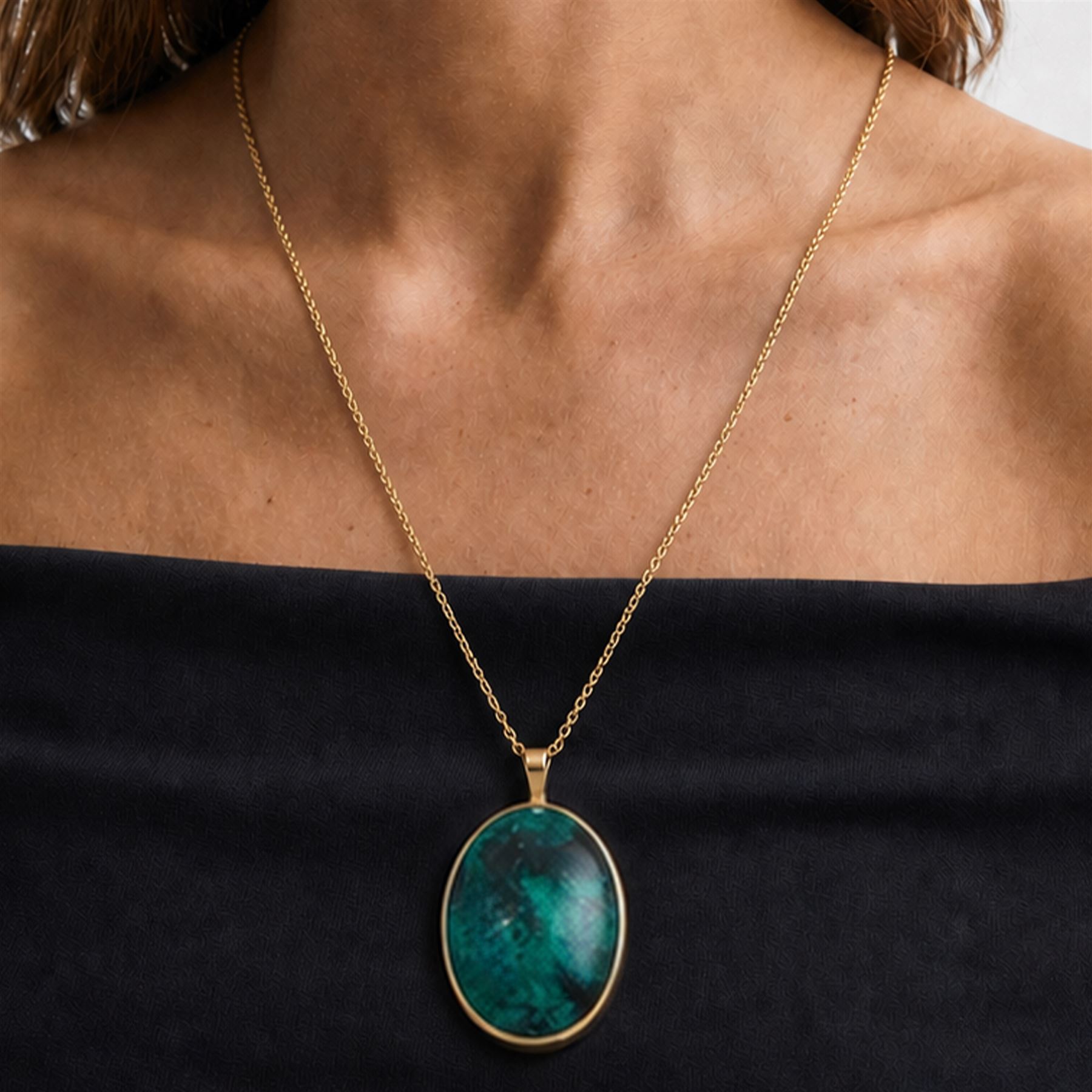 9ct gold azurite pendant necklace, bezel set oval cut azurite, on a gold belcher link chain necklace