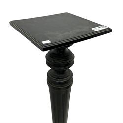 Late Victorian ebonised torchère or plant stand, square top on turned and fluted column, on square base 