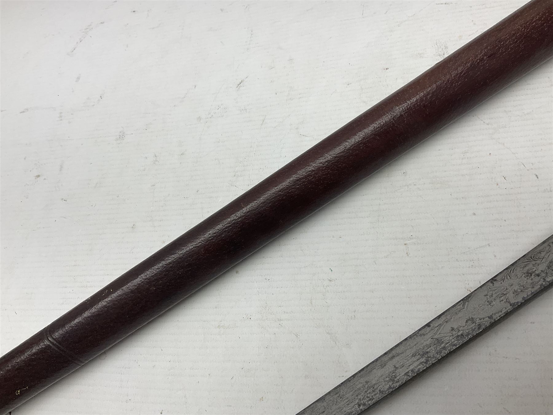 WWI 1821 pattern Royal Artillery officer's sword, the 82.5cm decorative blade by Hawksworth Sheffield etched with GVR cypher and crown, 'Royal Artillery' and field gun between scrolling foliate panels; three-bar hilt with wire-bound fish skin grip and chequered backstrap; in leather covered scabbard L99cm overall