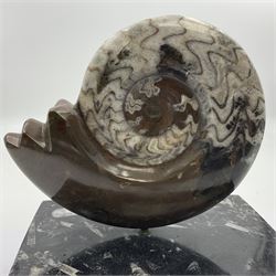 Goninite sculpture, poslised goninite, mounted upon a rectangular marble base with with orthoceras and goniatite inclusions, age: Devonian period, location: Morocco, H18cm