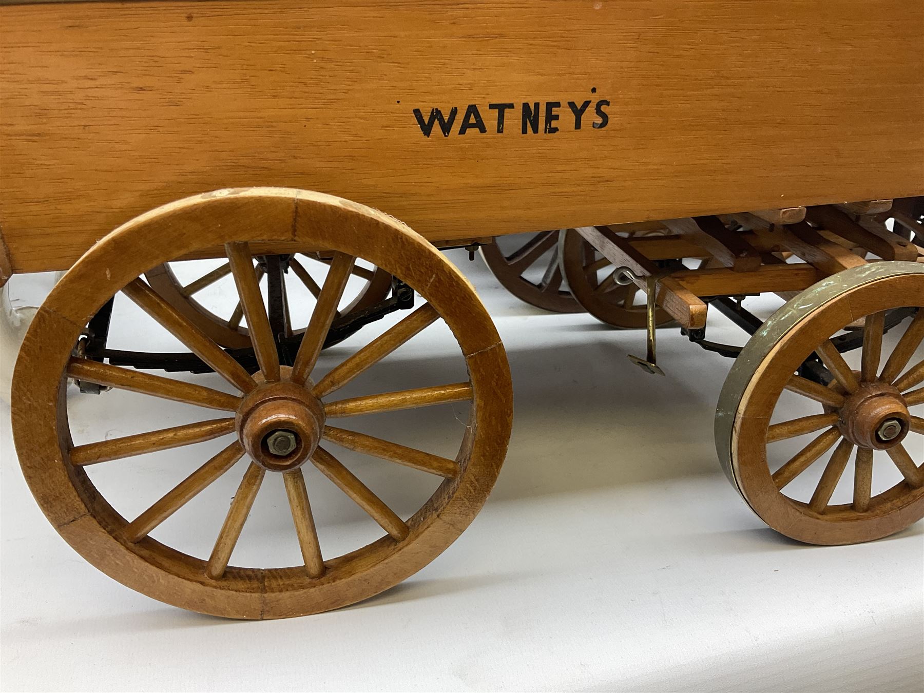 Four Melba Ware Shire horse figures and another similar, and three wood carts