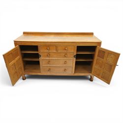 Mouseman - adzed oak dresser, rectangular top with galleried back, fitted with six drawers and two cupboards, blackened metal latches and circular hinges, with carved mouse signature, by the workshop of Robert Thompson of Kilburn