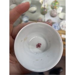 Group of eight 18th century and later Chinese famille rose and similar painted teabowls and dishes, to include unmarked peony cup, small cup decorated with flowers and butterfly, cup decorated with female figure gazing out of a window in a Buddhist temple with indistinct square character mark to base, pair of saucers unmarked, and others with character scenes unmarked (8)