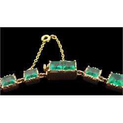 Late 19th/early 20th century gold green paste rivière necklace, the graduated square mixed-cut pastes in pinched claw open-backed settings