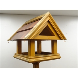  Timber bird table, with tiled rood, H198cm  