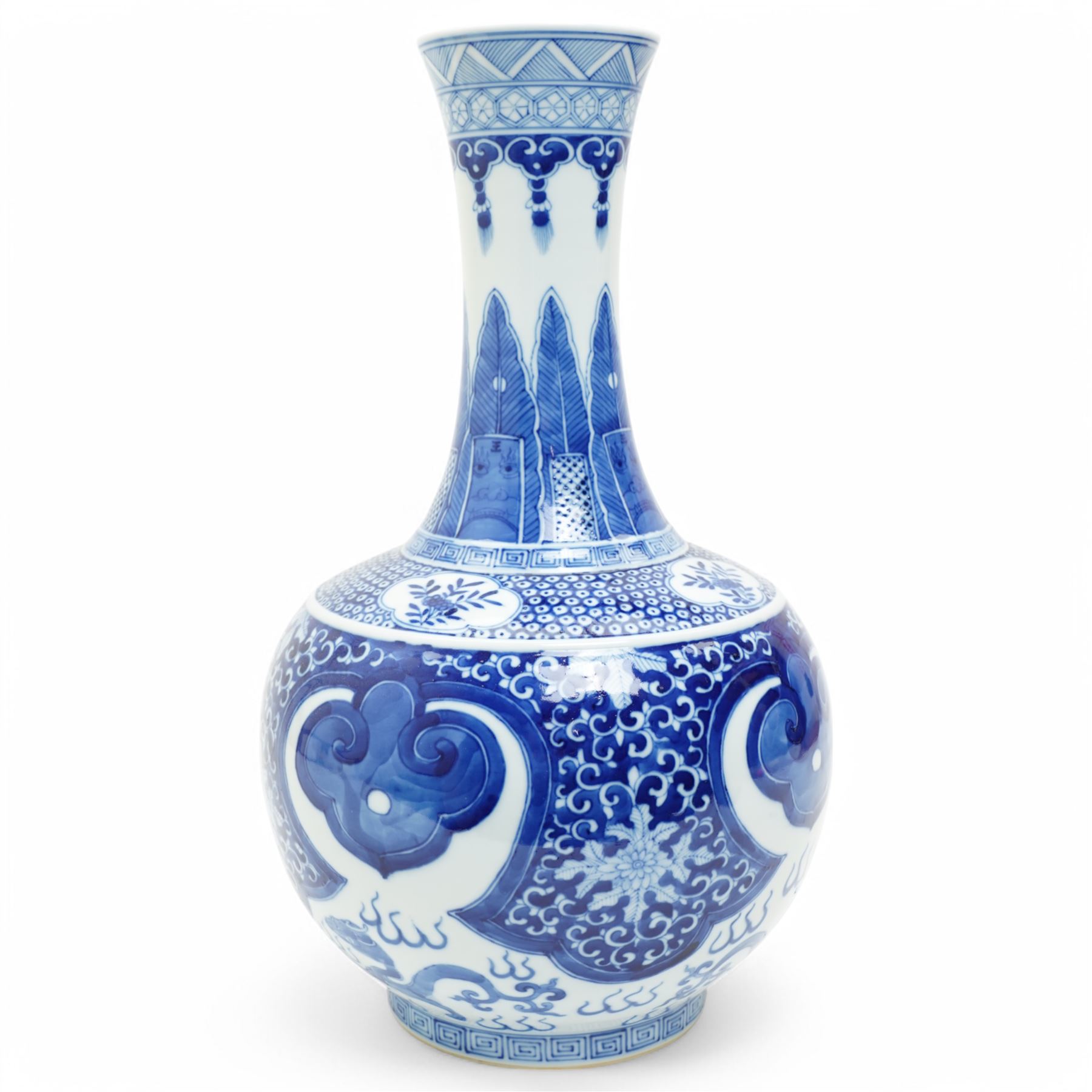 Late Qing Dynasty bottle vase decorated in blue and white with dragons and pearls, stylised leaves and flowers with key pattern foot H40cm 