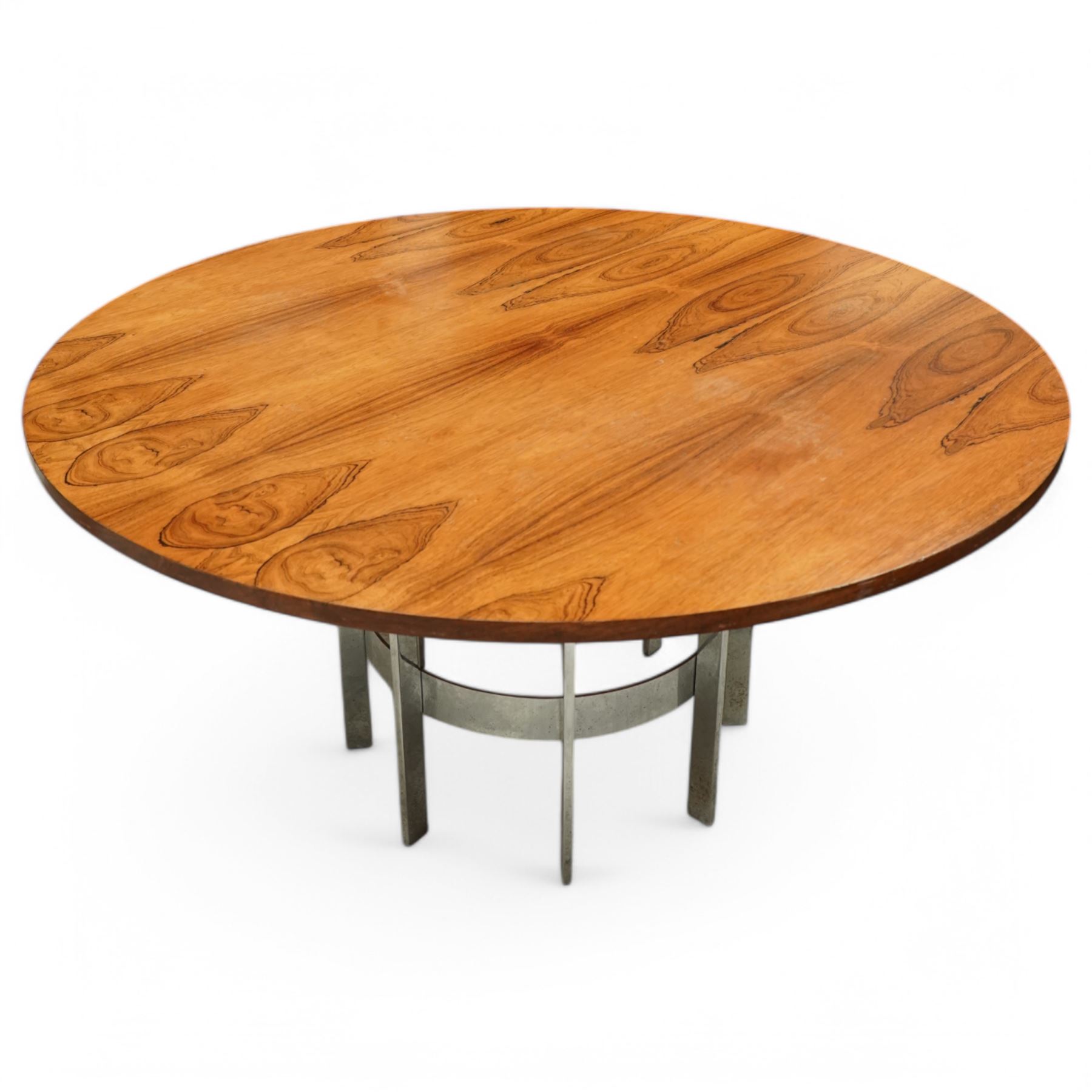 Mid-century Merrow Associates rosewood and chrome dining table, the circular top with striking rosewood veneers, raised on a chromed steel base of eight supports joined by a central ring stretcher