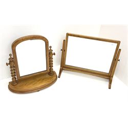 A Victorian satin walnut dressing table swing mirror, with turned supports and curved base, H57cm, together with another later oak example, H52cm.