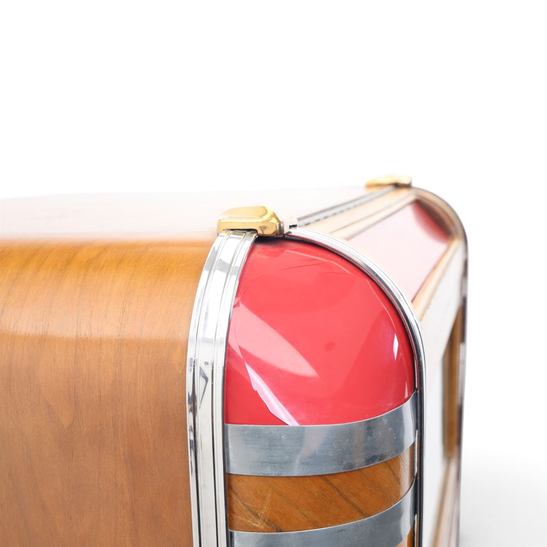 Rudolf Wurlitzer Company - Model 616 'Simplex' 1937 jukebox, figured walnut veneered cabinet with illuminated red and amber side panels enclosed by chromed uprights, glazed upper record compartment, cast Art Deco speaker grille, coin-operated push-button selection panel with circular title index, raised on a moulded base