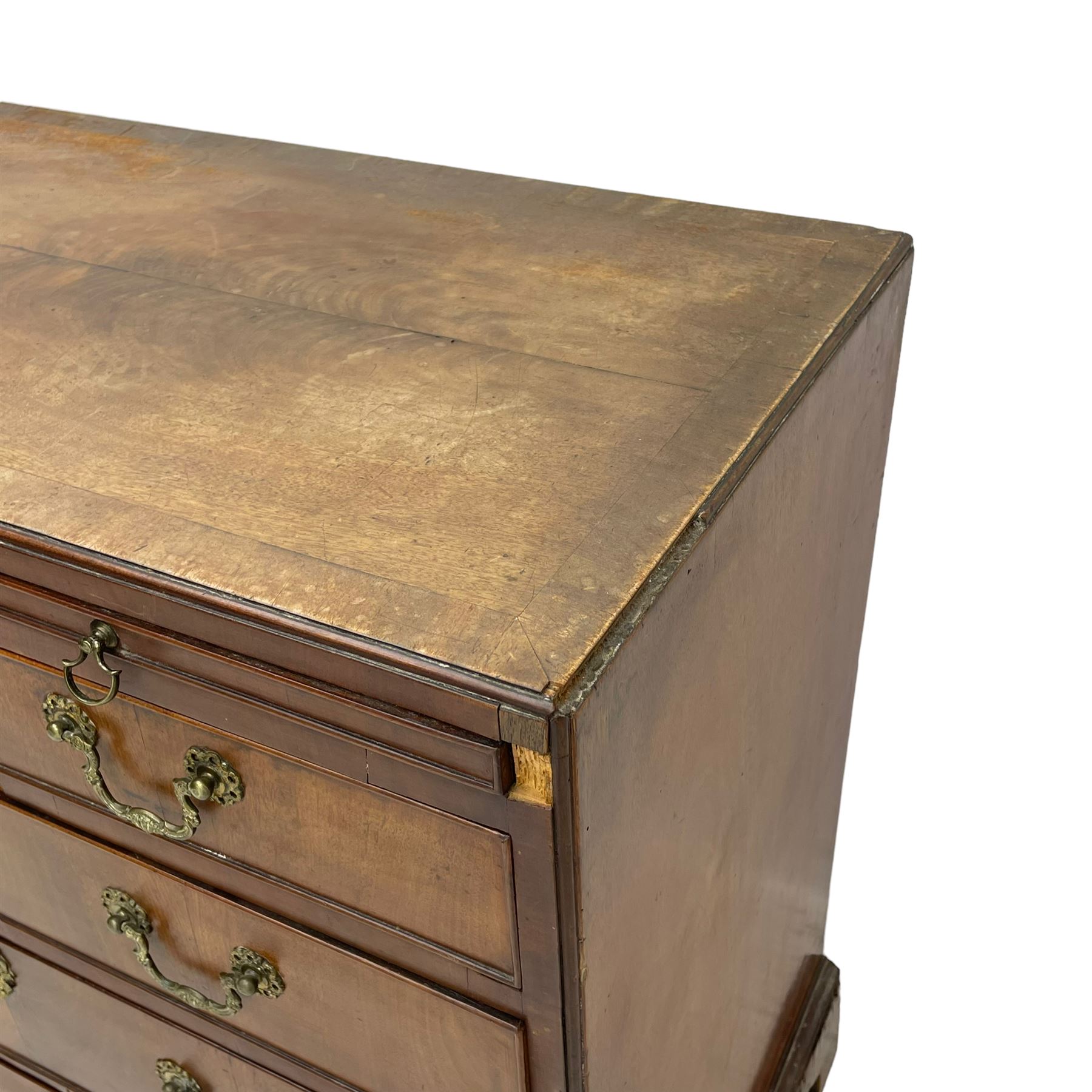 George III mahogany chest, banded caddy top with moulded edge, brushing slide over four graduating cock-beaded drawers, ornate cast gilt metal handle plates and escutcheons, swan neck handles cast with dolphins, shells and C-scrolls, lower moulding over bracket feet