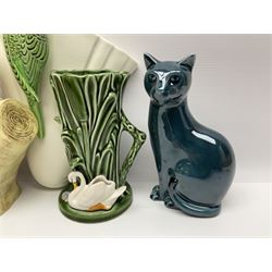 Sylvac budgieregar wall pocket, together with other Sylvac cermics including swan vases, blue tit vase and a frog figure etc, all with printed or impressed marks beneath, and a Poole Pottery cat figure, with printed mark beneath, wall pocket H22cm