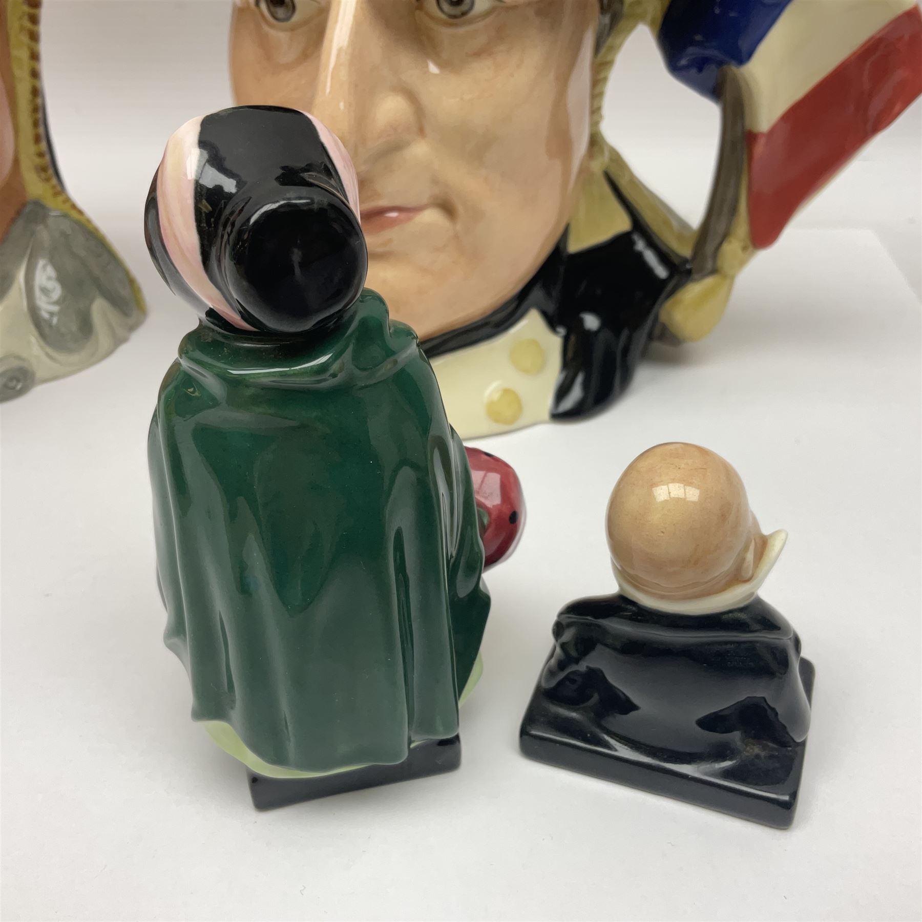 Royal Doulton two character jugs from the Star Crossed Lovers Collection, Antony & Cleopatra D6728 and Napoleon & Josephine D6750, together with two Royal Doulton Figures Micawber and Sairey Gamp