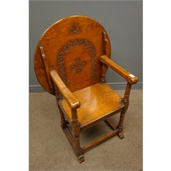  Early 20th century medium oak monks chair, guilloche carved back and rails, turned supports on sledge feet, W70cm  