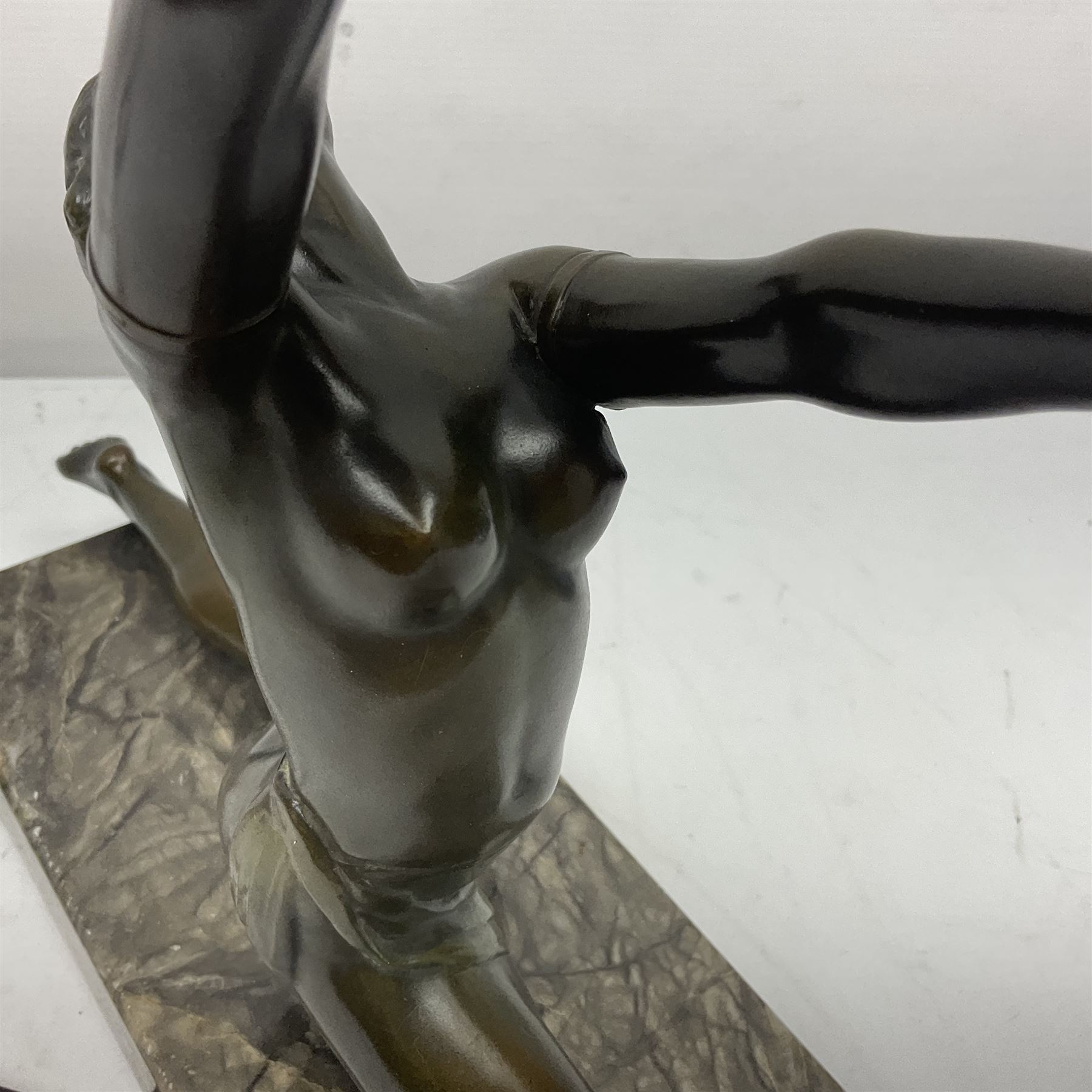 1930s Art Deco spelter table lamp, modelled as a nude woman holding aloft a spherical crizzled glass shade, upon a marble base, H48cm