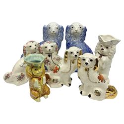 Three Pairs of Staffordshire style dogs, together with two Staffordshire style jugs, largest example H30cm 