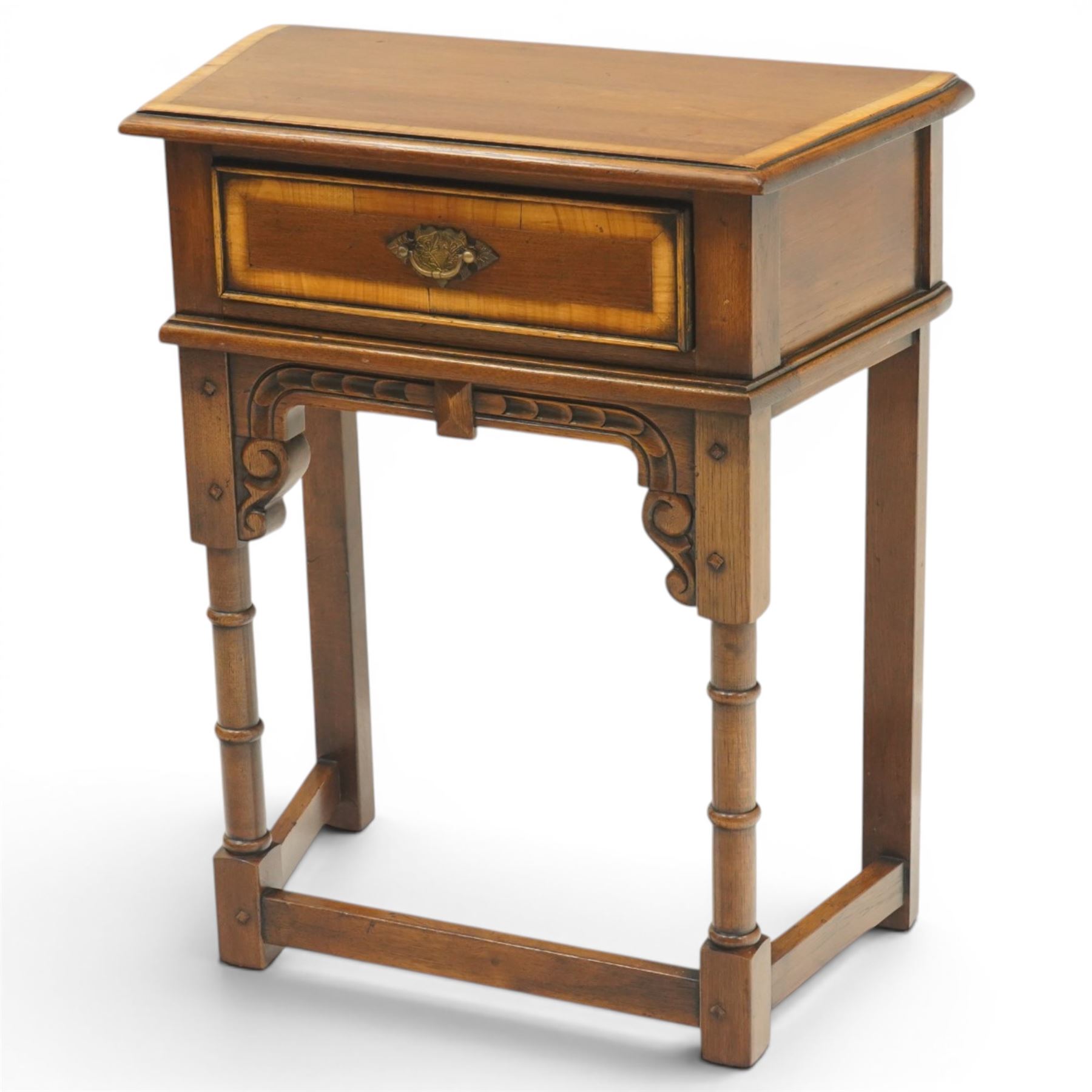 Titchmarsh & Goodwin style oak side table, the moulded top over one drawer with brass drop handle, raised on turned legs joined by a stretcher