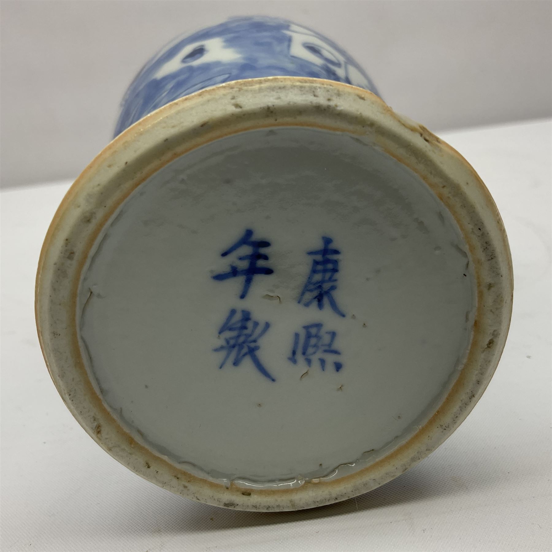 19th century Chinese Kangxi style blue and white jar and cover, decorated with figural and landscape scenes, the domed cover with foo dog finial, with four character marks beneath, H22cm