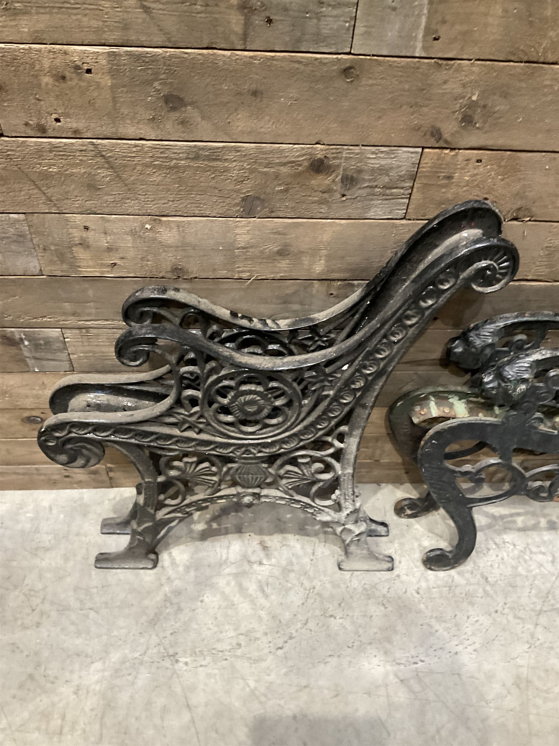 Four pairs of ornate cast iron bench ends (8)