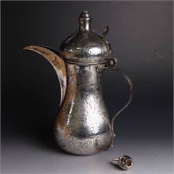 Middle Eastern silver coffee pot or Dallah, of baluster form with elongated spout and domed lid, with chased scrolling foliate decoration, the lid with applied silver plaque with presentation engraving, stamped 925 to base, H26.5cm