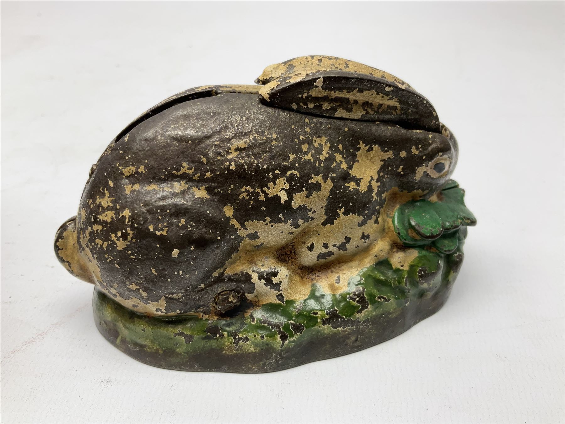 Two early 20th century cast-iron mechanical money banks - 'Rabbit on Cabbage' by Kilgore Manufacturing Company c1921 L11cm; and 'Elephant Swings Trunk' by A C Williams & Co patented 27th June 1905 L12.5cm (2)