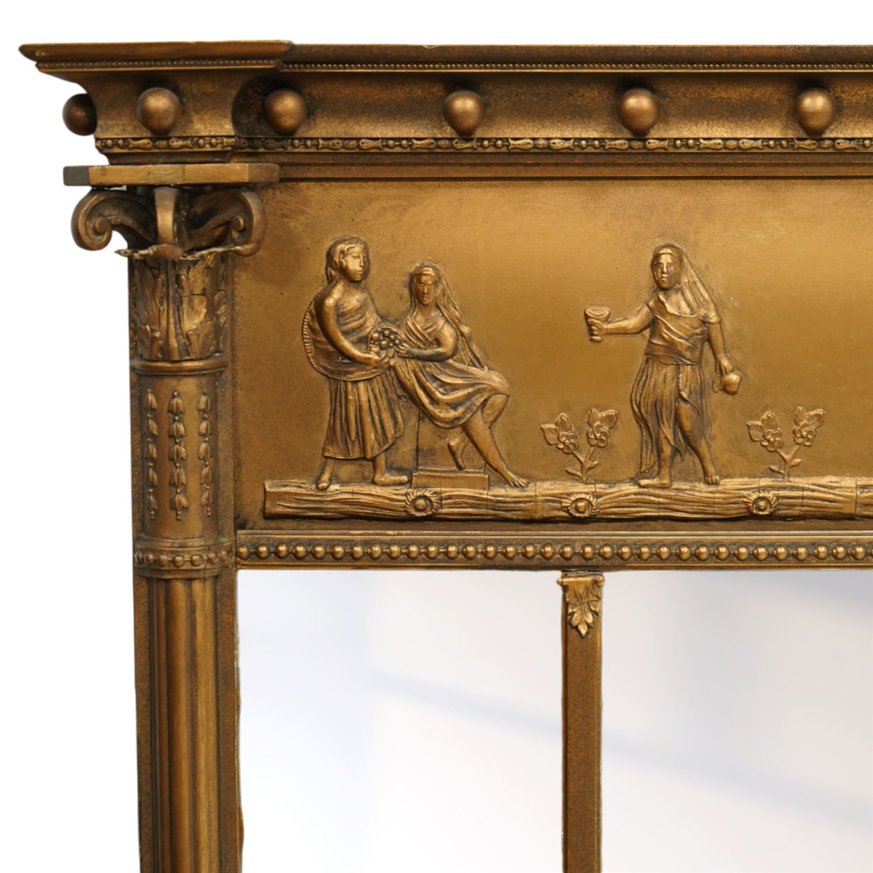 Early 20th-century giltwood tripartite overmantel mirror, rectangular frame with ball decorated cornice above frieze decorated with a classical allegorical depiction of the Triumph of Cybele in a processional chariot drawn by lions, above a beaded moulding and rectangular mirror plate, flanked by plain and reeded pilasters with Corinthian capitals, shafts decorated with pendant garlands  