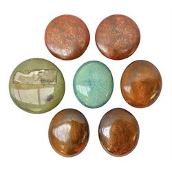 Henry George Murphy (1884-1939), collection of seven Arts & Crafts glazed ceramic roundels, of circular and oval form, five in tones of red and brown and two in tones of blue, turquoise and green in soufflé and high fired finishes, largest example D6.5cm