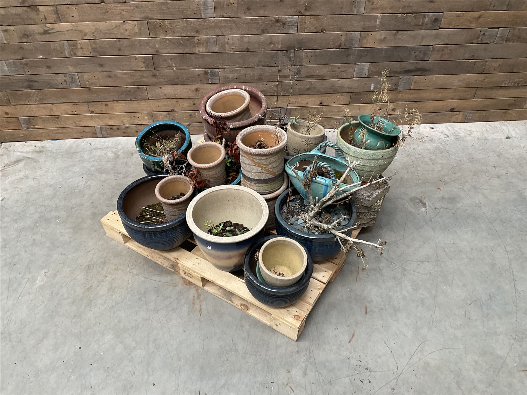 Large collection of ceramic plant pots and paving slabs, (26)