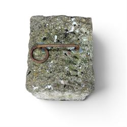 19th century carved tethering stone, square sloping form with iron work loop