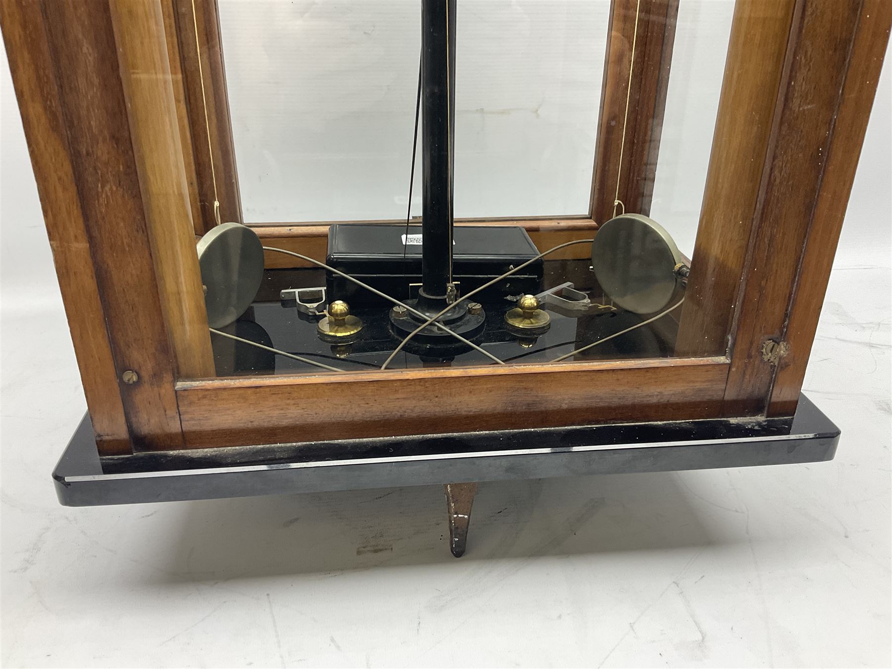 Set of laboratory balance scales by Reynolds & Branson of Leeds in fully glazed mahogany case with rise-and-fall front door, black vitrolite base with brass feet and hand cranked action L40cm H51.5cm D30cm; and bakelite cased set of brass weights