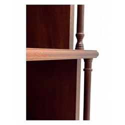 Mid-20th century mahogany open bookshelf, the rectangular top with a brass balustrade gallery, over three shelves each supported by turned column uprights, on shaped apron base