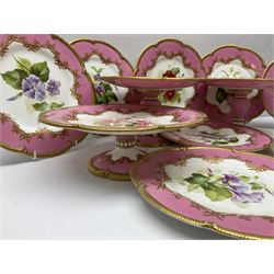 Victorian dessert service, comprising four comports and nine plates, each decorated with floral sprigs to the centre with a pink and gilt border, largest comport H13cm, plate D22.5cm