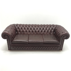 Three seat chesterfield sofa upholstered in a deep buttoned maroon leather, W205cm