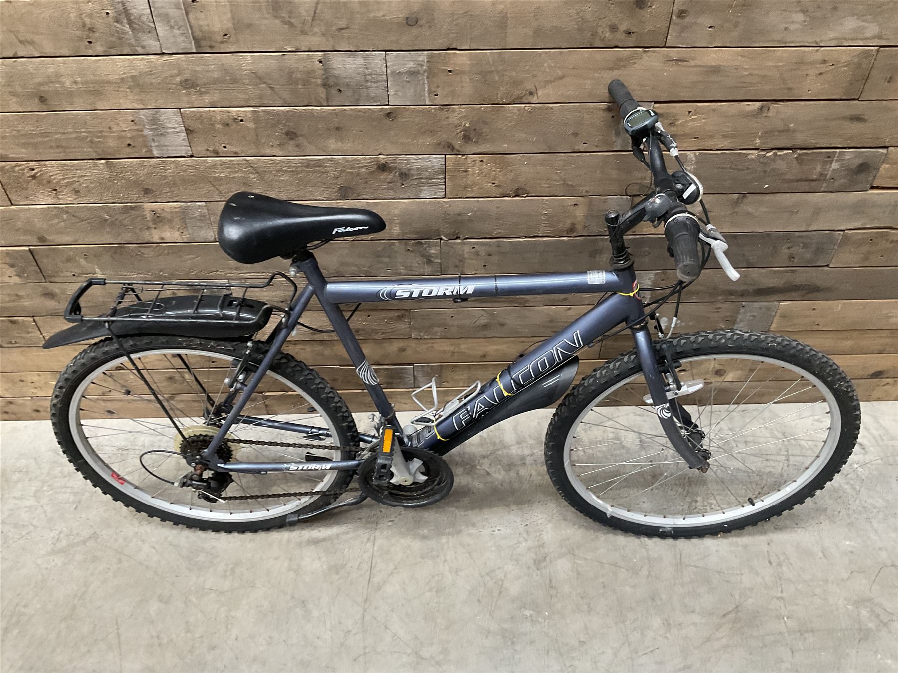 Three bicycles- man’s Falcon Storm 18 speed mountain bike; lady’s Dawes Sonoran 24 speed road bike; child’s Apollo 18 speed bike (3)