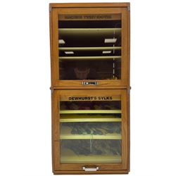 Haberdashery cabinet, with Dewhurst's Sylko Three Shells Machine Twist branding, consisting of two sections to the front, each with four shelves and door to the back for access, with Abel Morrall Ltd makers plaque, H85cm, W36cm. 