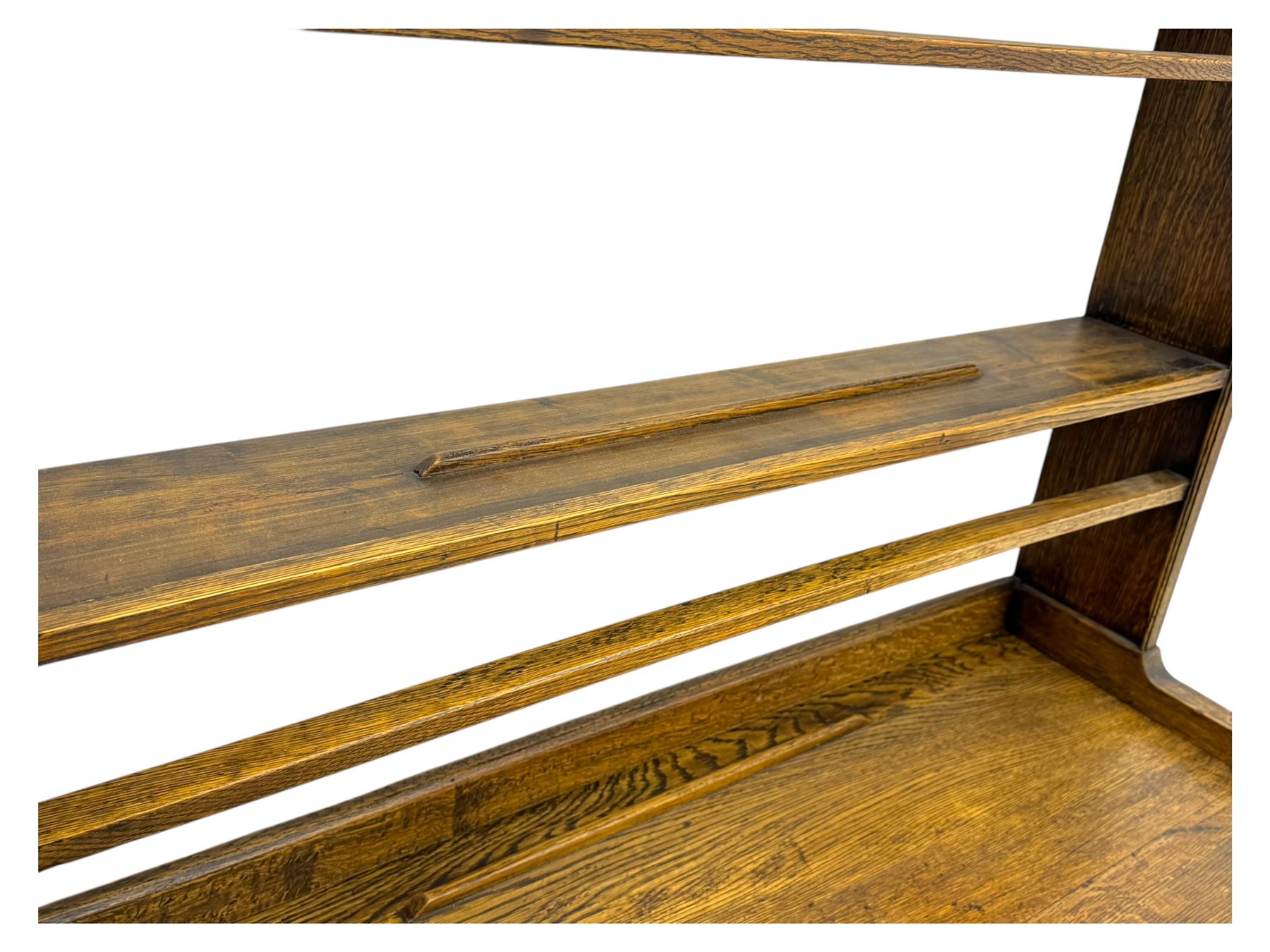 19th century and later oak dresser, moulding cornice a pierced and shaped frieze, over two open plate shelves above a base fitted with two drawers with brass swan neck handles, over panelled twin cupboard with single shelf, cantered corners on bracket feet