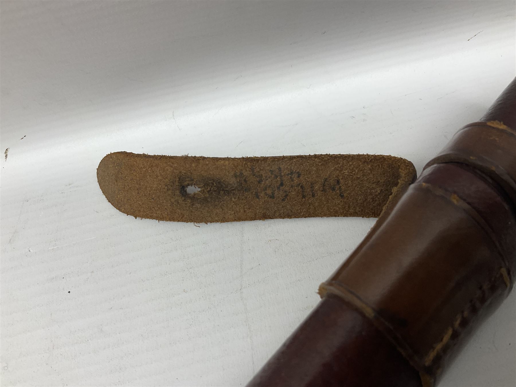 WWI 1821 pattern Royal Artillery officer's sword, the 82.5cm decorative blade by Hawksworth Sheffield etched with GVR cypher and crown, 'Royal Artillery' and field gun between scrolling foliate panels; three-bar hilt with wire-bound fish skin grip and chequered backstrap; in leather covered scabbard L99cm overall