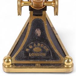 19th century brass binocular microscope by R&J Beck, London, numbered 5527, with rack and pinion focusing, with four eye pieces and three objective lenses, in wooden case