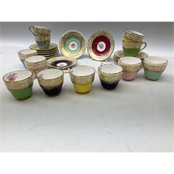 Twelve Spode Ruskin pattern coffee cups and saucers, with floral bouquets, varying colour grounds and gilt
