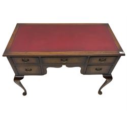 Mid 20th century walnut kneehole writing/dressing table, rectangular moulded top with leather inset, fitted with five drawers, on cabriole supports