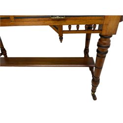 Late Victorian Aesthetic Movement walnut and inlaid ebony dressing table, swing mirror back with shell carving and spindle support rail, fitted with two trinket drawers and single frieze drawer, raised on ring turned supports with castors