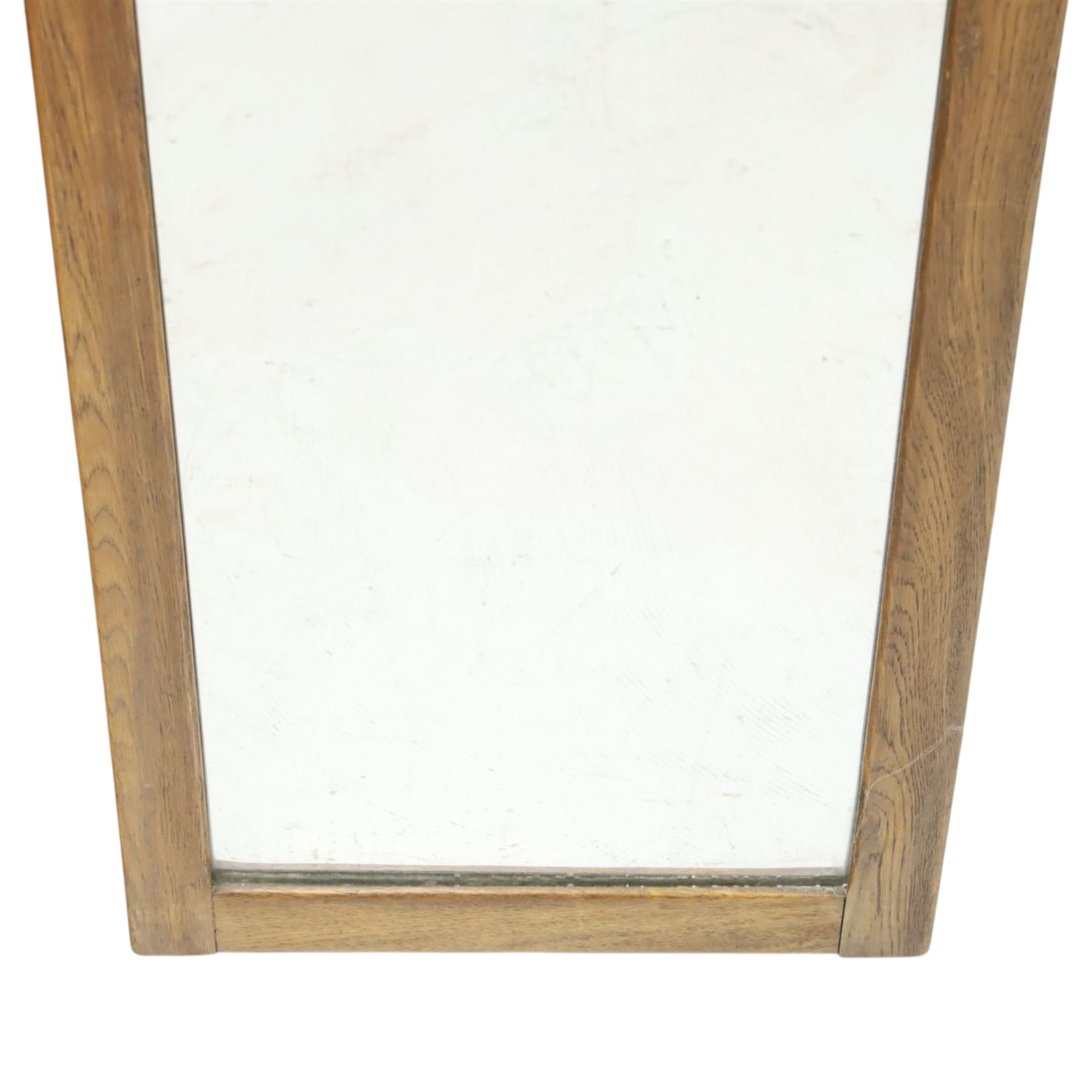 In the manner of  Yorkshire Critters - oak framed rectangular wall mirror, plain frame with carved arcade decoration to the cresting rail