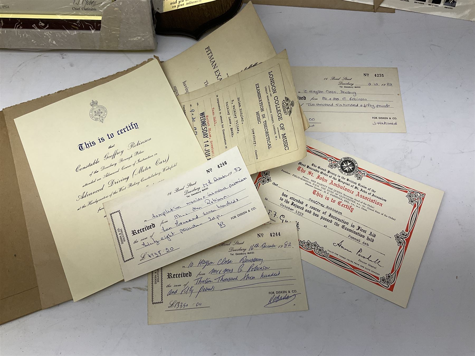Archive of memorabilia and ephemera relating to Pc. (later Sgt.) Geoffrey Robinson of Dewsbury (later West Yorkshire) police force including cased Long Service and Good Conduct Medal; helmet plates and cap badges, collar numbers and uniform buttons, whistles, certificates, photographs, plaque etc 1960s - 1990s