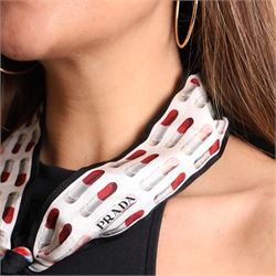 Prada - silk twill skinny scarf, decorated with repeating lipstick motif in red, pink and grey, with black border