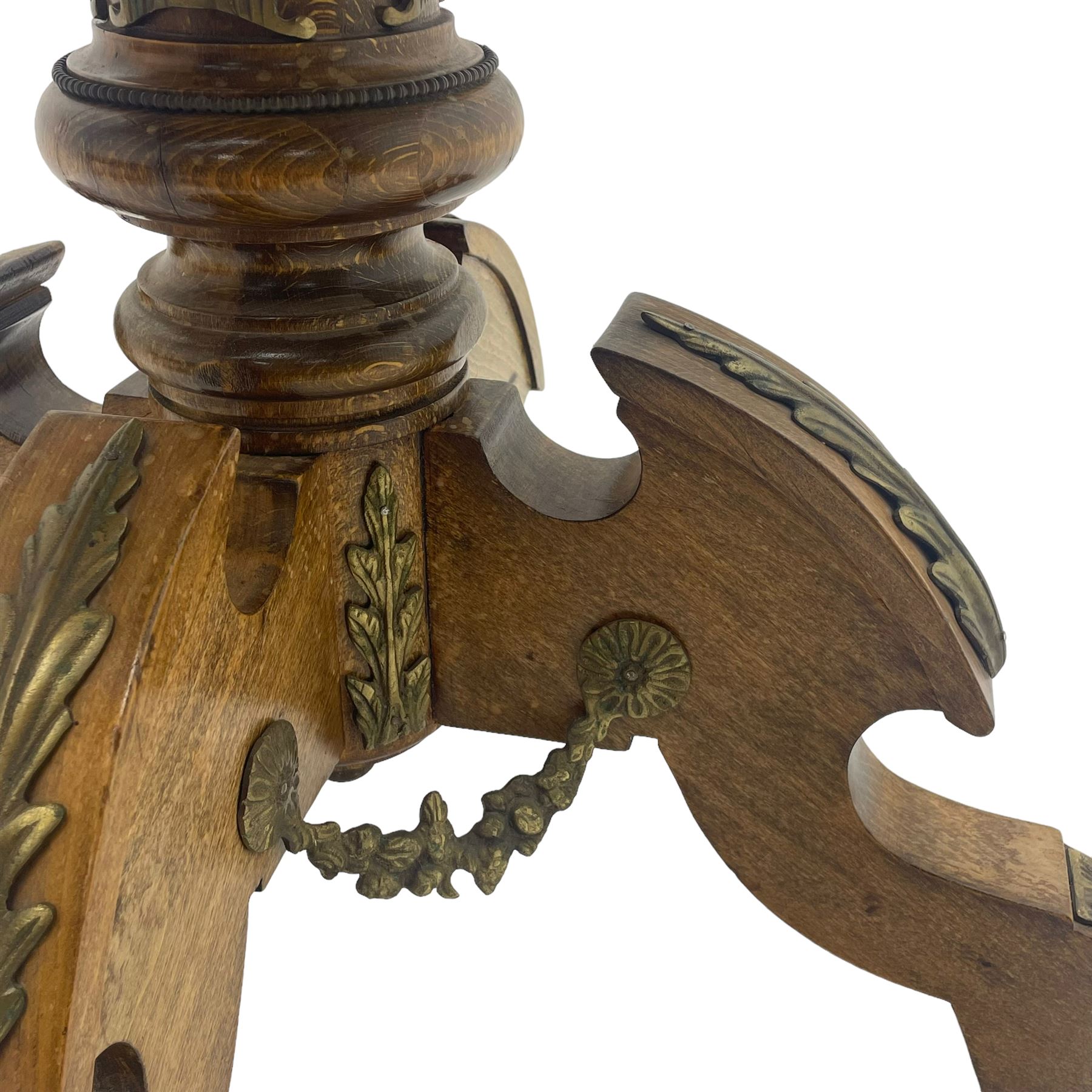 Mid-20th century figured walnut Italian design centre table, octagonal quarter veneered top with cross banding and moulded edge, the skirt decorated with scrolling foliage gilt metal mounts, on turned pedestal mounted with gilt acanthus leaves, quadruple splayed supports with further acanthus leaf decoration