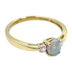9ct gold three stone oval opal and diamond ring, hallmarked