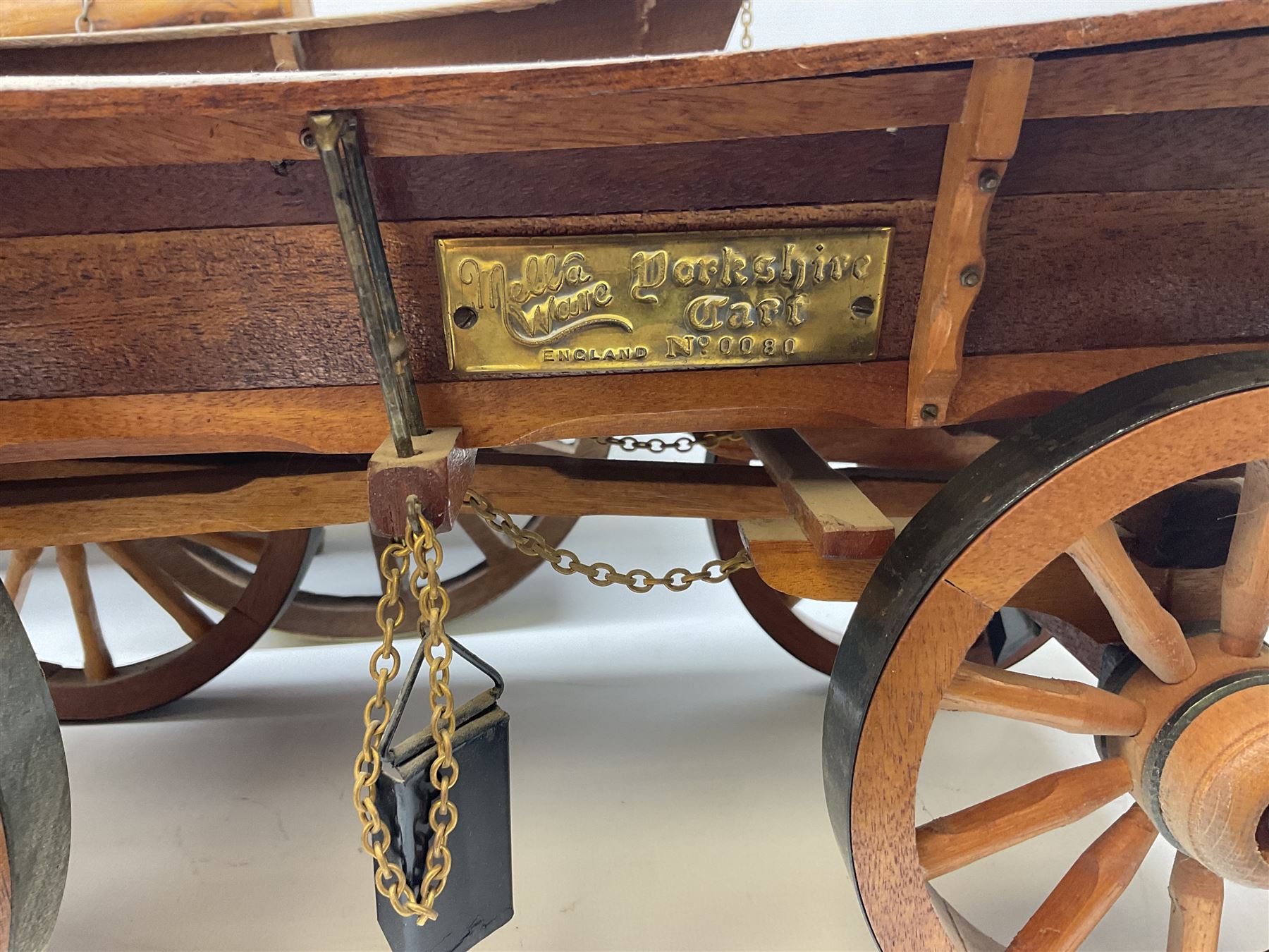 Four Melba Ware Shire horse figures and another similar, and three wood carts