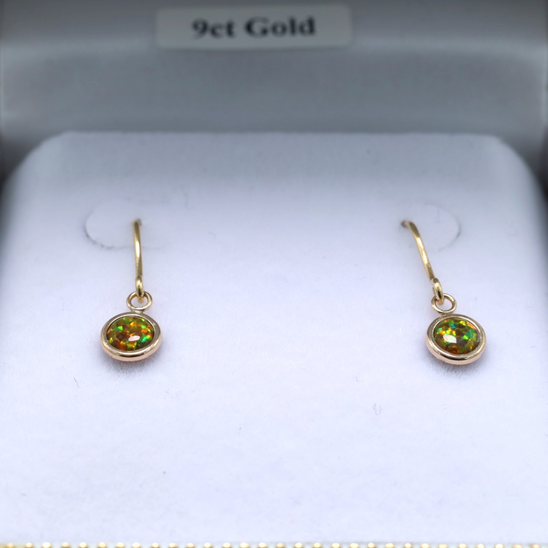 Pair of 9ct gold opal pendant earrings, boxed